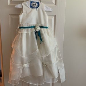 Childrens formal off white dress with removable flower pin and ribbon belt.